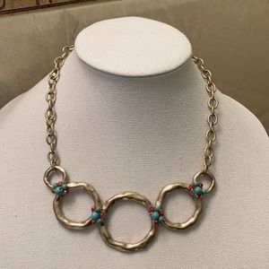 Gold hammered necklace w/turquoise/strawberry bead